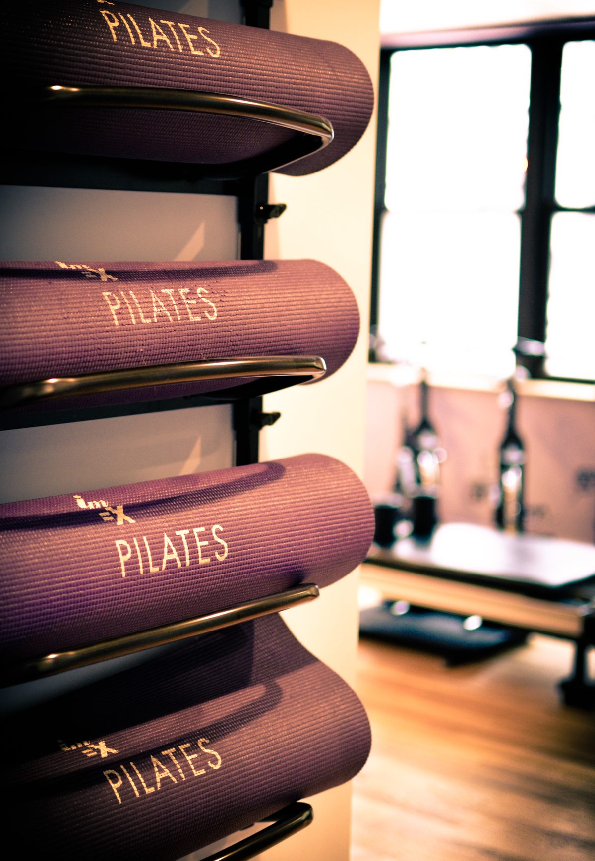 IM=X Pilates mats racked in the Midtown Manhattan studio